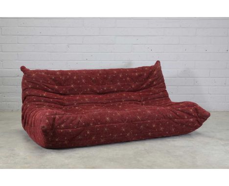 A Ligne Roset 'Togo' settee, modern, originally designed by Michel Ducaroy in 1973, with burgundy fabric with star motifs, 17