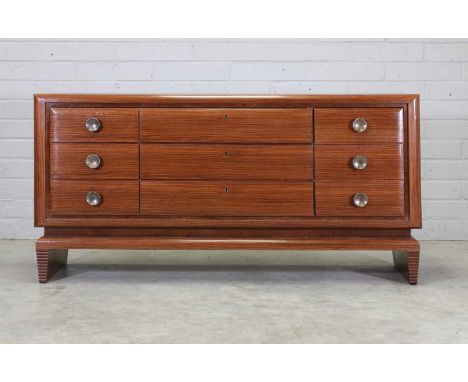 A French palisander commode,c.1950, with a leather inset top, with six drawers comprising three short and three long, fitted 