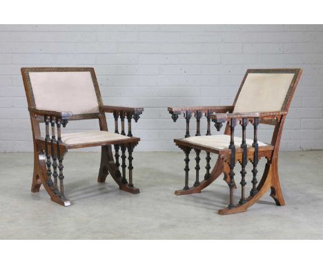 A pair of walnut chairs, by Carlo Bugatti (1856-1940) each with a swept back, with turned and copper-mounted supports and mou