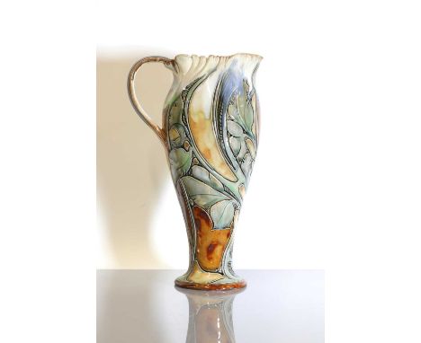 A Royal Doulton stoneware ewer, by Mark V Marshall, the tapering body with deep incised leaf spiral decoration, impressed mar