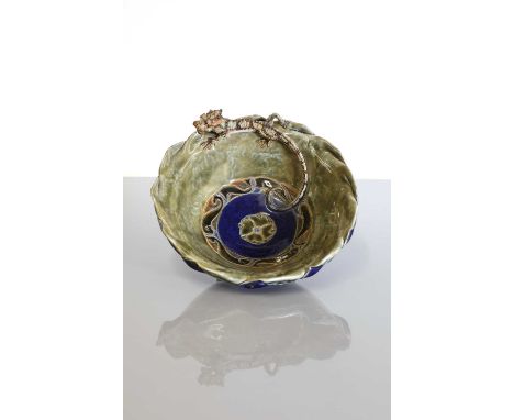 A Royal Doulton stoneware bowl,by Mark V Marshall, decorated to the exterior in a blue glaze, to the interior with a mottled 