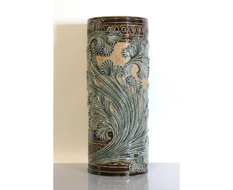 A Doulton stoneware cylindrical vase,dated 1881, by Mark V Marshall, deeply modelled with scrolling foliage, on a stamped gro