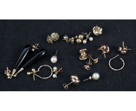 A collection of 9ct gold and yellow metal earrings including amber, pearl, cameo set etc