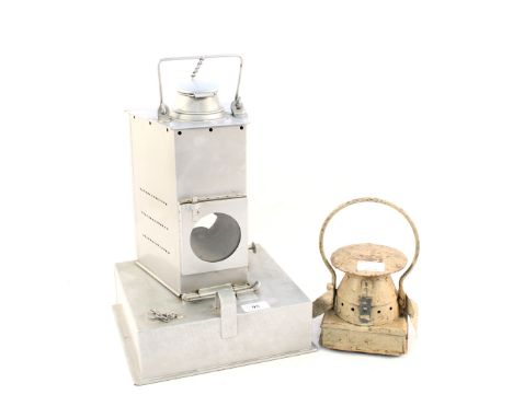 A galvanised metal oil lantern plus a London Transport lamp top