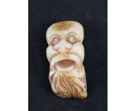 A bone face netsuke