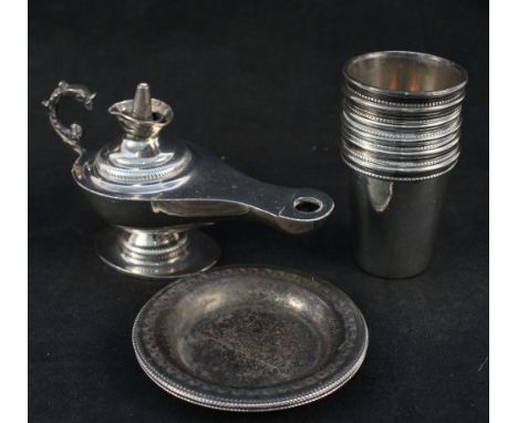 An Egyptian white metal Aladdins lamp (as found) plus tot glasses and four small dishes 