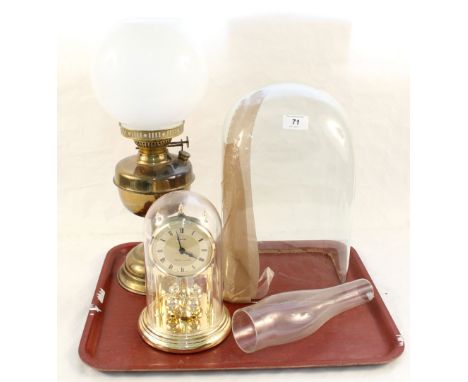 A brass oil lamp, dome clock plus glass dome (cracked)