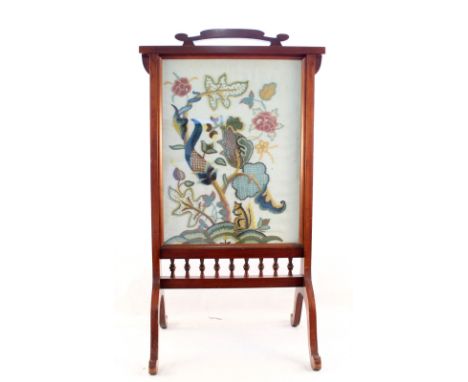 A mahogany woolwork floral fire screen