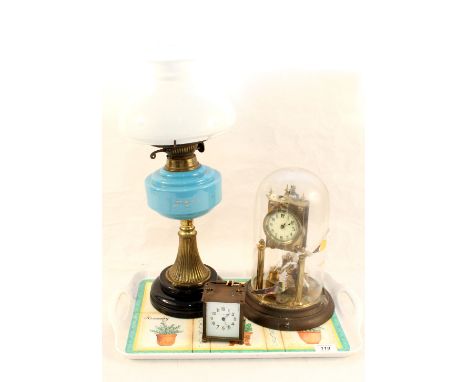 A brass column oil lamp plus dome and carriage clocks