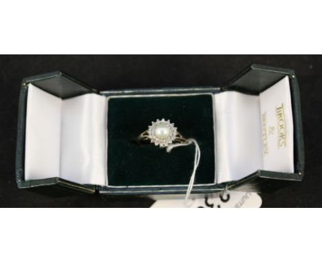 A 9ct gold pearl and diamond cluster ring (with certificate), size O