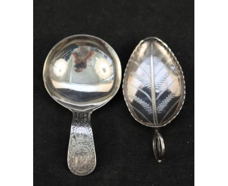A Georgian silver caddy spoon with engraved and initialled handle, maker I.B. plus one other of leaf form with pierced edge