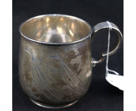 A silver mug with chased yacht designs, J.E.R.N. monogram, Goldsmiths & Silversmiths Co, London 1938