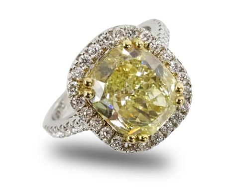 GIA Certified 4.01 Carat Cushion Cut Fancy Light Yellow Diamond and 18 Karat White Gold Engagement Ring Accented Throughout w