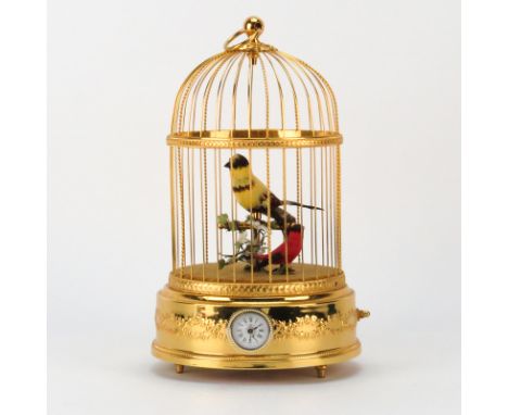 Reuge, Swiss, Two-Bird Singing Bird Cage with Alarm Clock, Battery Powered. Late 20th century. Signed. The brass retains its 