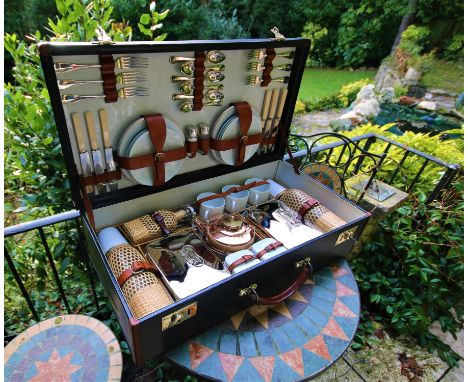 This is an excellent, complete picnic set, possibly totally original in lovely condition especially when considering it was c