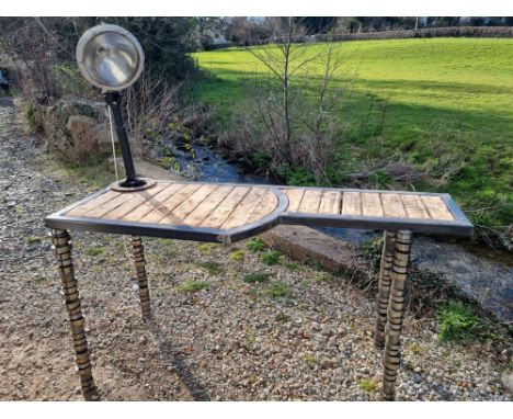 Using hand-formed steel and reclaimed burnt treated Pallet wood, this impressive table also recycles Volvo truck camshafts fo