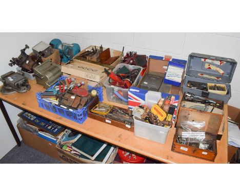 A selection of clock workshop tools including taps and dies, screwdrivers, files, pliers, drill bits, measuring implements, g