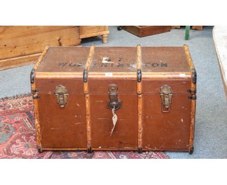 A wooden bound travel trunk