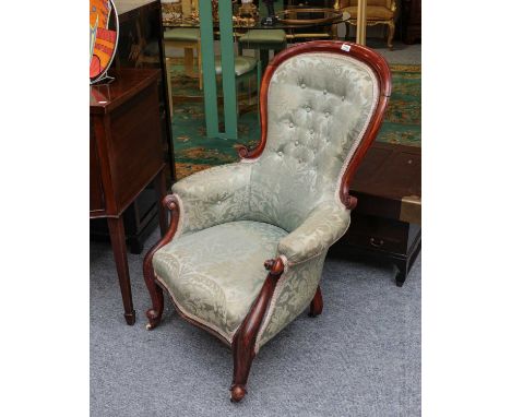 A Victorian carved mahogany button-back chair