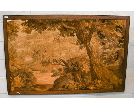 An early 20th century tapestry depicting a woodland scene, in an oak frame, 153cm by 98cm