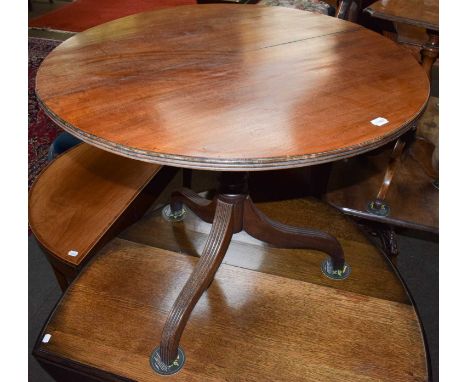 A George III mahogany tilt top tripod table, 82cm by 69cm