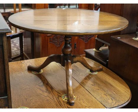 A 1920s oak barley twist drop leaf dining table, 148cm by 106cm (open) by 73cm; together with a carved oak blanket box, an oa