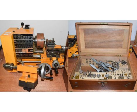 Emco Compact 8 lathe, with a box containing collets and three Rolex case back opening tools