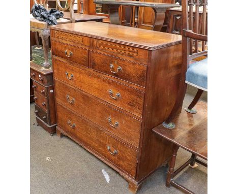 A 19th century oak four height chest of drawers, with a further two drawers concealed in the frieze, raised on bracket feet, 