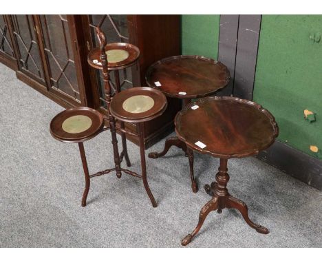 An Edwardian mahogany two-tier oval occasional table, 66cm wide; a reproduction mahogany tripod table, with scalloped moulded