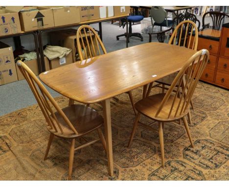 An Ercol light elm dining table and set of four spindle back chairs, table 147cm by 77cm by 71cm (5)