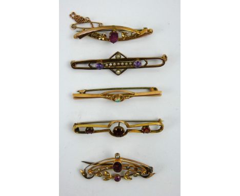 Five antique gem set 9ct gold bar brooches including an opal, amethyst, garnets and seed pearls.&nbsp; Gross combined weight 