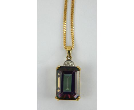 9ct gold zircon type stone pendant on a fine 9ct gold chain. Pendant 16mm x 10 mm. Chain 46cm. Gross combined weight 5.6 gram