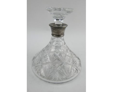 A Royal Doulton cut crystal ship's decanter with hallmarked silver collar. Hallmark Birmingham 1981. No chips or cracks.