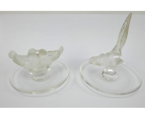 Two Lalique glass ring dishes, love birds and a golden pheasant. Both signed to base 'Lalique France'. Condition report: Chip