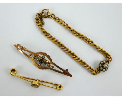 An antique yellow metal bar brooch, a damaged 9ct gold seed pearl bar brooch and seed pearl set chain link bracelet. Gross co