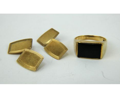 A pair of 9ct gold engine turned cufflinks and a 9ct gold black onyx ring, size S. Gross combined weight 10.9 grams.