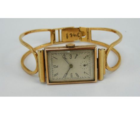 A 1970s rectangular gentlemen&rsquo;s watch, 9ct gold movement marked Trebex, bangle strap marked variously marked to clasp 7