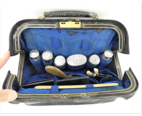 Victorian fitted gentleman's travel bag by Martin &amp; Co with silver topped jars and other contents. Hallmarked for London 