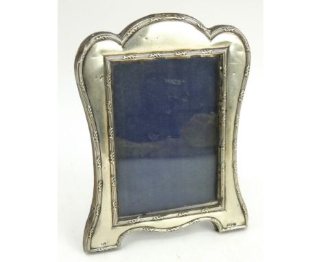 An Edwardian silver photo frame with velvet easel back, hallmarked Chester 1908, J &amp; R Griffin. Height 19.5cm, width 14.5