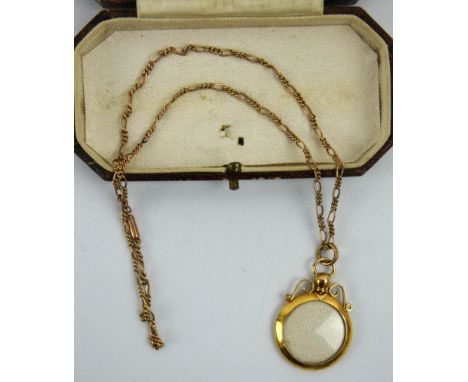 A 9ct gold Edwardian locket pendant on a 9ct marked fancy link chain. Diameter 2.2cm. Gross combined weight 4.4 grams.&nbsp;