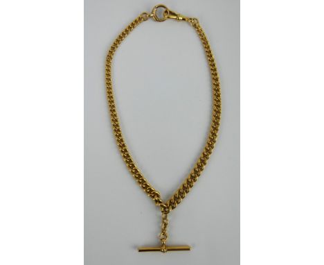 An 18ct gold curb link Albert watch chain, each link stamped 18ct, suspending an 18ct gold T-bar  stamped 18ct makers mark E.
