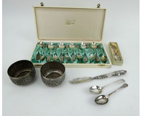 12 Swedish silver teaspoons, a silver caddy spoon, 2 English silver teaspoons, butter spreader and 2 repousse Indo-Persian po