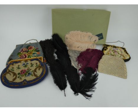 Three vintage tapestry handbags, a diamante evening bag and a box of fashion feathers of various colours.