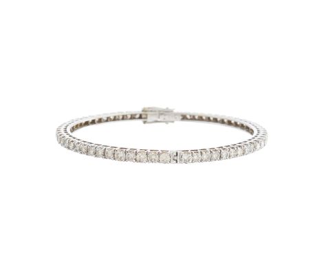 A brilliant-cut diamond line bangle bracelet, total diamond weight 9.15ct, engraved to clasp, estimated I-K colour, VS2-SI cl