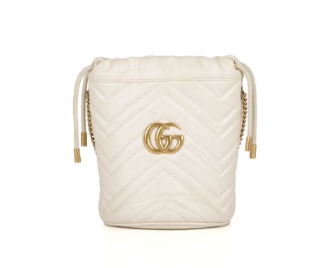 Gucci, a Mini Marmont bucket handbag, featuring a chevron quilted cream leather exterior with heart detail to the reverse, br