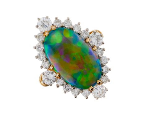 An 18ct gold oval black opal cabochon and brilliant-cut diamond cluster dress ring, with grooved shoulders, opal measures app