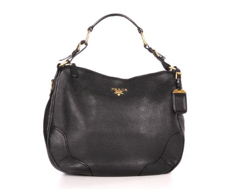 Prada, a black hobo handbag, designed with a black pebbled leather exterior, gold-tone hardware to include maker's front logo