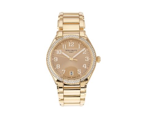Patek Philippe, an 18ct rose gold Twenty-4 bracelet watch, factory diamond set bezel and gilt sunburst dial, reference 7300/1