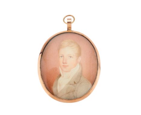 A late Georgian portrait miniature, circa 1810, watercolour on ivory, painted to depict a young fair haired boy wearing a bro