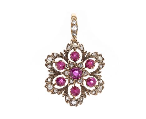 A late Victorian silver and gold, ruby and vari-cut diamond floral cluster openwork pendant, estimated total ruby weight 1.50